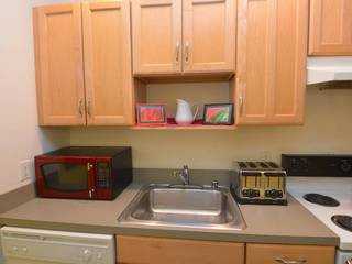Fully equipped kitchen with microwave, toaster, dishwasher, pots and pans