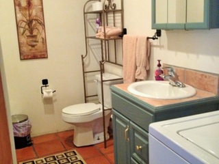 Half bath downstairs with laundry room